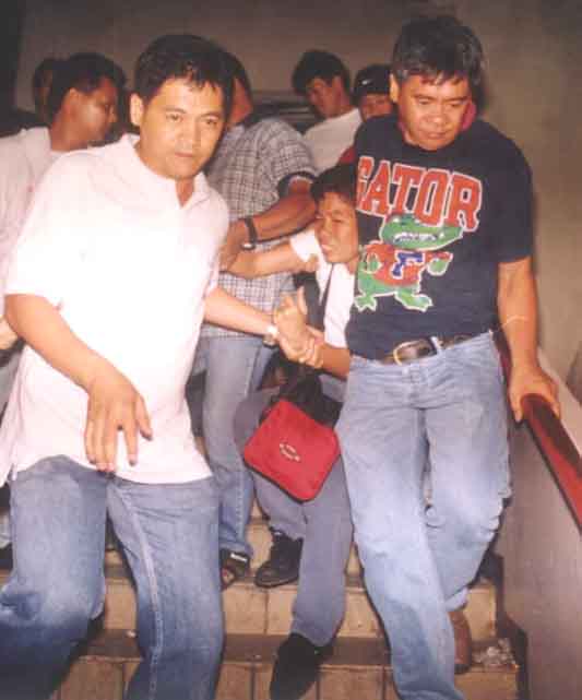 Plainclothesmen Forcibly Arresting a Strike Supporter